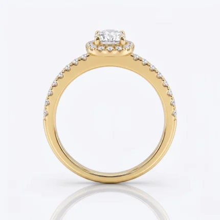 Gold engagement ring with a large center diamond and pavé diamonds along the band, in yellow gold jewel setting.