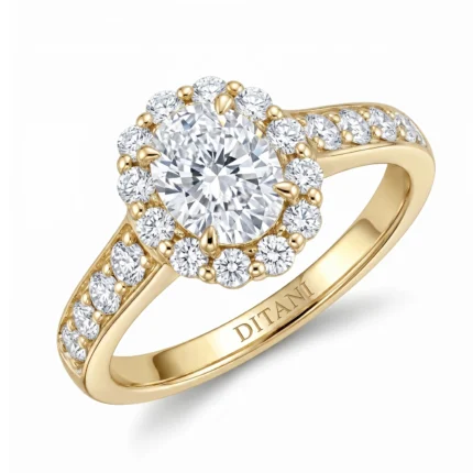 Gold halo engagement ring with a large center diamond surrounded by smaller diamonds on a yellow-gold band