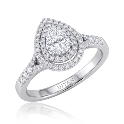 Pear-cut center diamond surrounded by multiple diamond halos and pavé bands on a silver ring, high-shine finish, DITANI brand on inner band