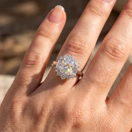 Close-up of a large central diamond ring on the finger, surrounded by a halo of smaller diamonds.