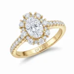 Yellow gold engagement ring with a large center diamond surrounded by a halo of smaller diamonds and a pavé-diamond band; engraved DITANI on the inner band.