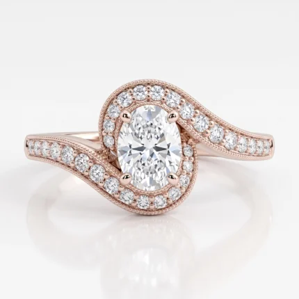 Rose gold ring featuring an oval center diamond with a diamond halo and a pavé diamond band along a split shank.