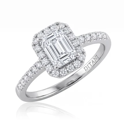 Engagement ring with an emerald-cut center diamond surrounded by a diamond halo and pavé band (DITANI).