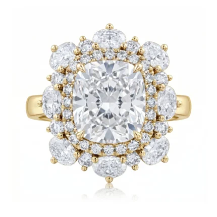 Yellow gold ring with a large cushion-cut center diamond and double diamond halo, surrounded by smaller round diamonds in a floral cluster.