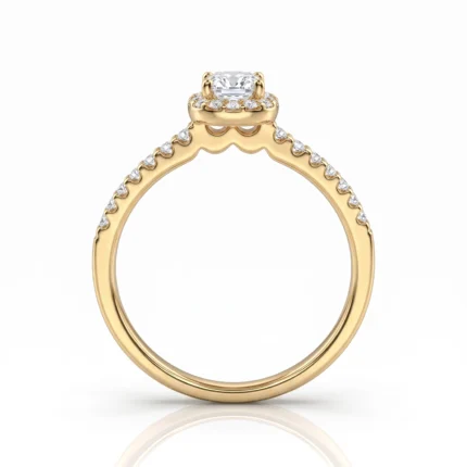 Gold engagement ring with a cushion-cut center diamond and pavé diamonds along the band.