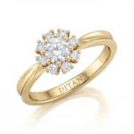 Gold ring with a flower-shaped cluster of diamonds in a halo setting on a yellow-gold band, DITANI engraved inside the band