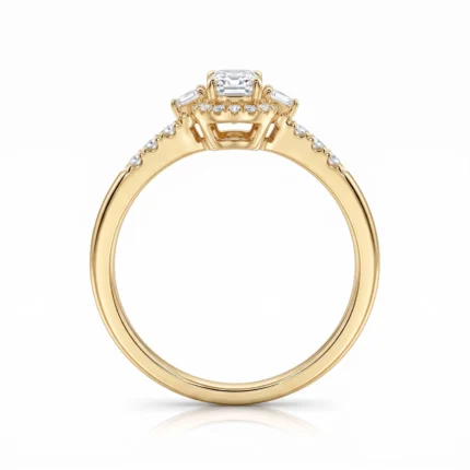Gold engagement ring with a prominent rectangular center diamond and small diamonds along the band’s shoulders, shown from the side.