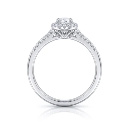 Engagement ring in white metal with a central diamond and pavé diamonds along the band, shown against a white background with reflection.