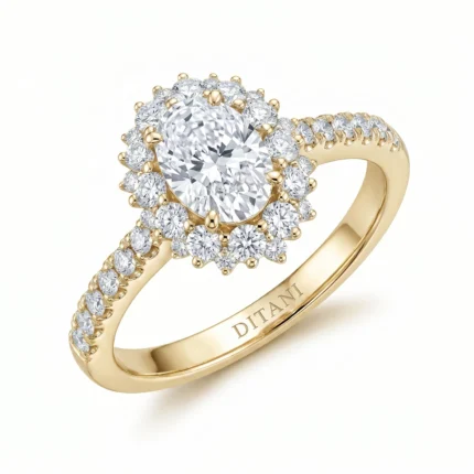 Gold halo diamond ring with a large center stone surrounded by smaller diamonds on a yellow-gold band