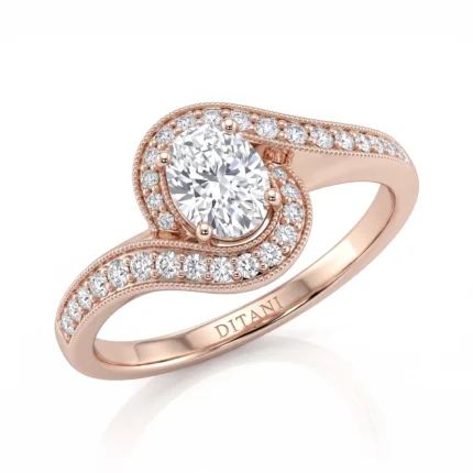 Rose gold ring with a large central diamond surrounded by pavé diamonds in a curved halo setting on a split shank.