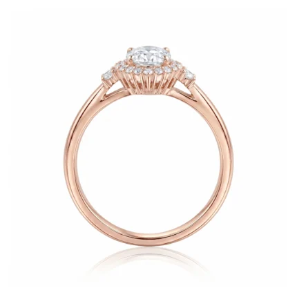 Rose gold engagement ring with an oval center diamond and a pavé diamond halo set on a split shank.