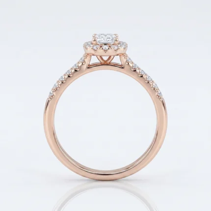 Rose gold engagement ring with a rectangular center diamond and pavé diamonds along the band, close-up detail image
