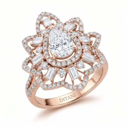 Rose-gold ring with a pear-cut center diamond surrounded by halo and ornate pavé diamonds.