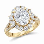 Yellow gold ring with a large round center diamond surrounded by a halo of smaller diamonds