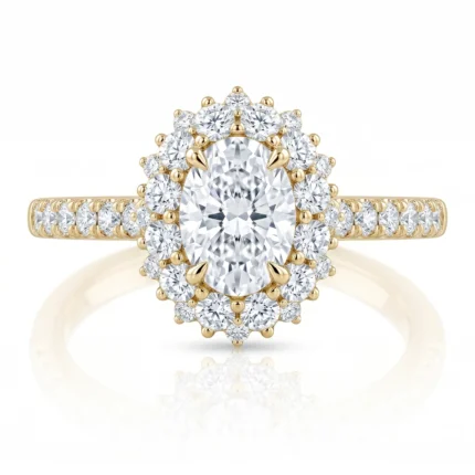 Gold engagement ring with a large oval center diamond surrounded by a halo of smaller diamonds on a diamond-studded band.