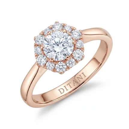 Rose gold halo engagement ring with a center diamond surrounded by smaller diamonds in a flower halo.