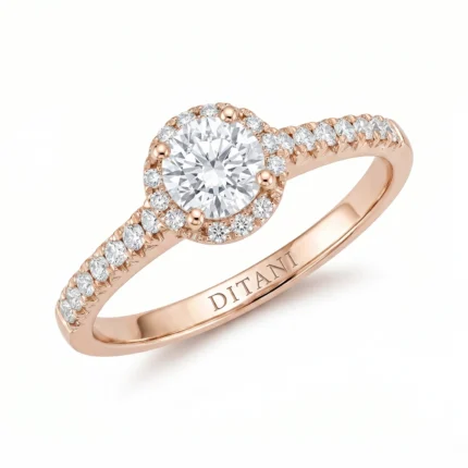 Rose gold halo engagement ring with a round center diamond encircled by smaller diamonds and a pavé diamond band, 'DITANI' engraved inside the band.