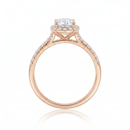 Rose gold engagement ring with a cushion-cut center diamond and pavé diamonds along the band.
