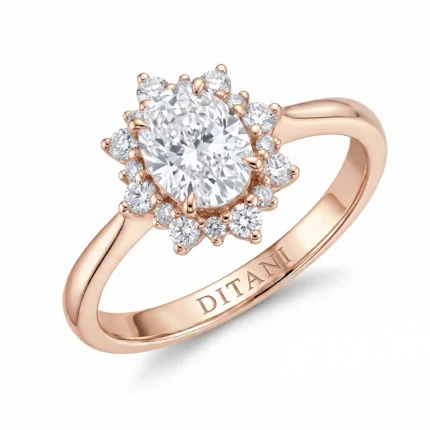 Rose gold ring with a large central diamond surrounded by a halo of smaller diamonds and the DITANI engraving on the band.