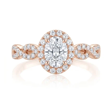 Rose gold halo diamond ring with a large central diamond and pavé-band accents on the shank.
