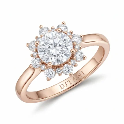 Rose gold ring with a large central diamond surrounded by ahalo of smaller diamonds; band engraved with DITANI on the inner side