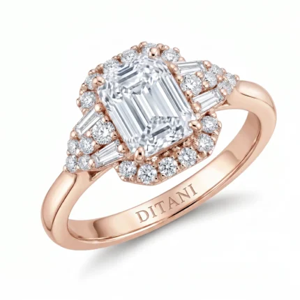 Rose gold ring with an emerald-cut center diamond, surrounded by a double halo of smaller diamonds and side stones.