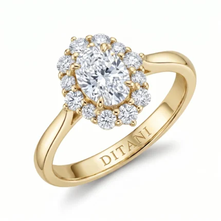Yellow gold ring with a large central diamond encircled by a halo of smaller diamonds.