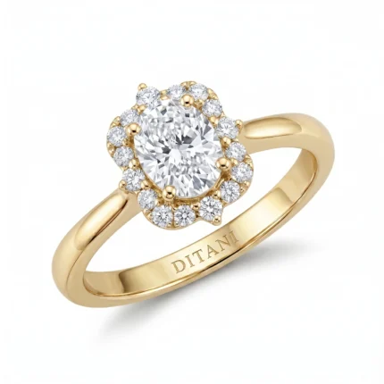 Gold ring with an oval center diamond surrounded by a halo of smaller diamonds on a polished band.