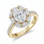 Yellow gold halo engagement ring with a large center diamond surrounded by pavé diamonds.