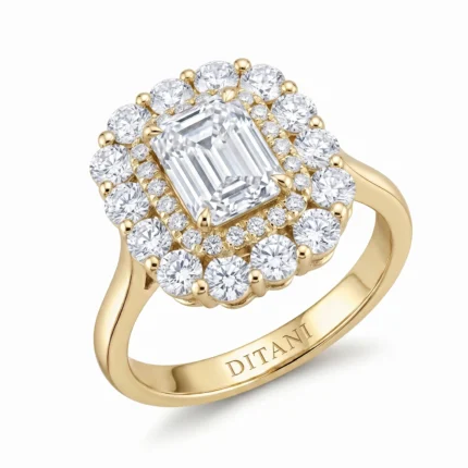 Gold ring with a large emerald-cut center diamond, surrounded by a double halo of round diamonds set in yellow gold. Engraved 'DITANI' on the band.