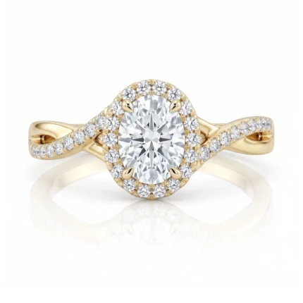 Gold ring with an oval center diamond surrounded by a halo of small diamonds.