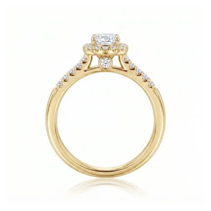 Gold engagement ring with a cushion-cut center diamond, raised prongs, and pavé diamonds along the band.