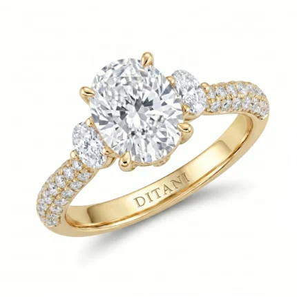 Gold ring with a large center round diamond, two smaller side diamonds, and a pavé-set diamond band; engraving inside reads 'DITANI'