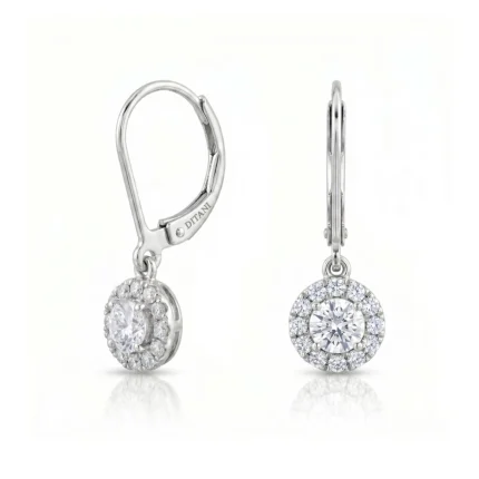 Silver lever-back diamond halo earrings with a central round diamond and surrounding smaller diamonds (Ditani).
